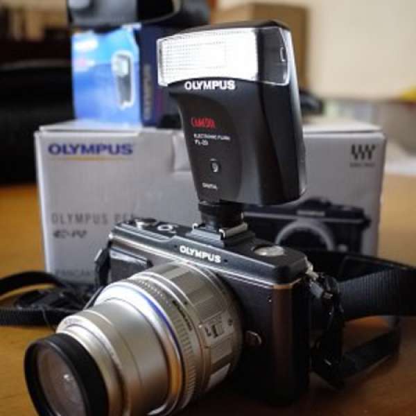 Olympus EP2 + 14-42mm kit lens + Flash FL20