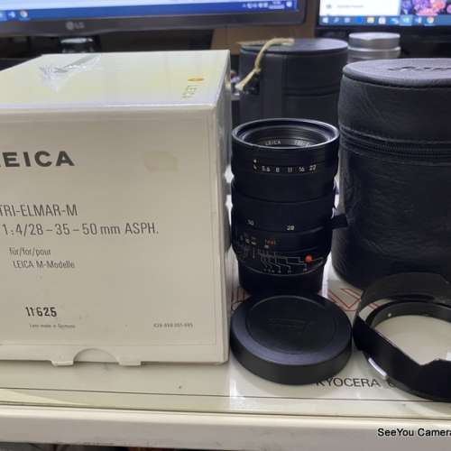 95% New Leica 28-35-50mm f/4 Tri-Elmar E49 Lens with hood & box $29500. Only