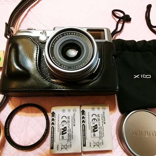 Fuji X100 with leather case, B+W filter lens , 2 original battery, thumb rest .
