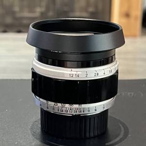 Canon 50mm f1.2 ltm lens with 3rd party hood and adapter to M