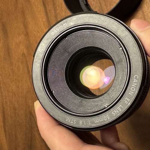 90% new used Canon EF f/1.8 STM lens with Canon stock ES-68 hood