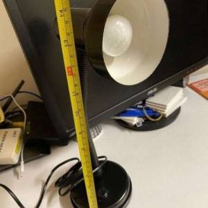 The desk lamp has an adjustable angle.