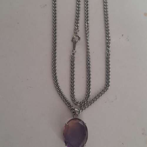 紫黃晶蛋形吊墜，20x16x6mm.切割面純銀托，配廿四寸不銹鋼頸鏈。no.19.3.25