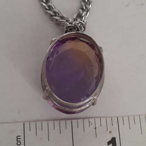 紫黃晶蛋形吊墜，20x16x6mm.切割面純銀托，配廿四寸不銹鋼頸鏈。no.19.3.25