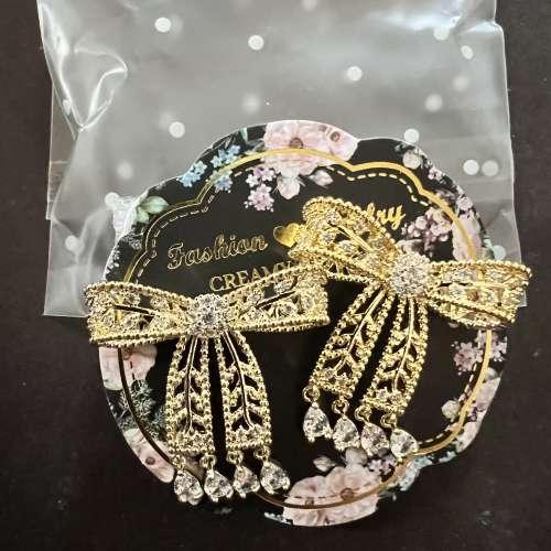 Embellished ribbon gold tone earrings