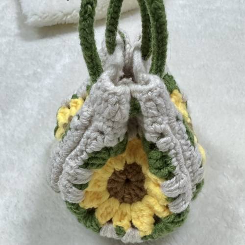 手編太陽花織扣掛袋