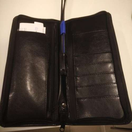 Equestrian leather travel wallet with retractable strap
