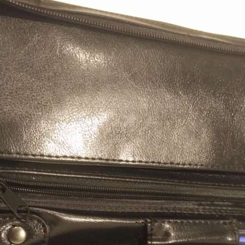 Equestrian leather travel wallet with retractable strap