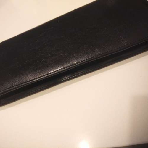 Equestrian leather travel wallet with retractable strap