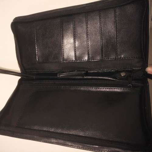 Equestrian leather travel wallet with retractable strap