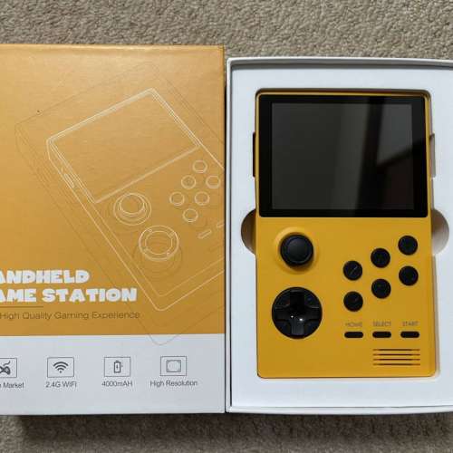 Yellow Handheld Game Station with Pandora Games Mini system.