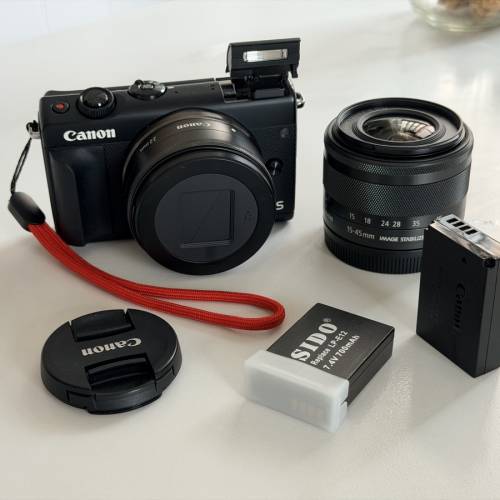 canon m100 + 22mm + 15-35 kit lens