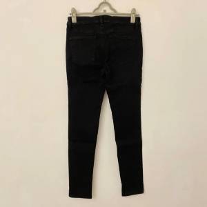 UNIQLO 女裝黑色修身有彈性牛仔褲 Size 27
